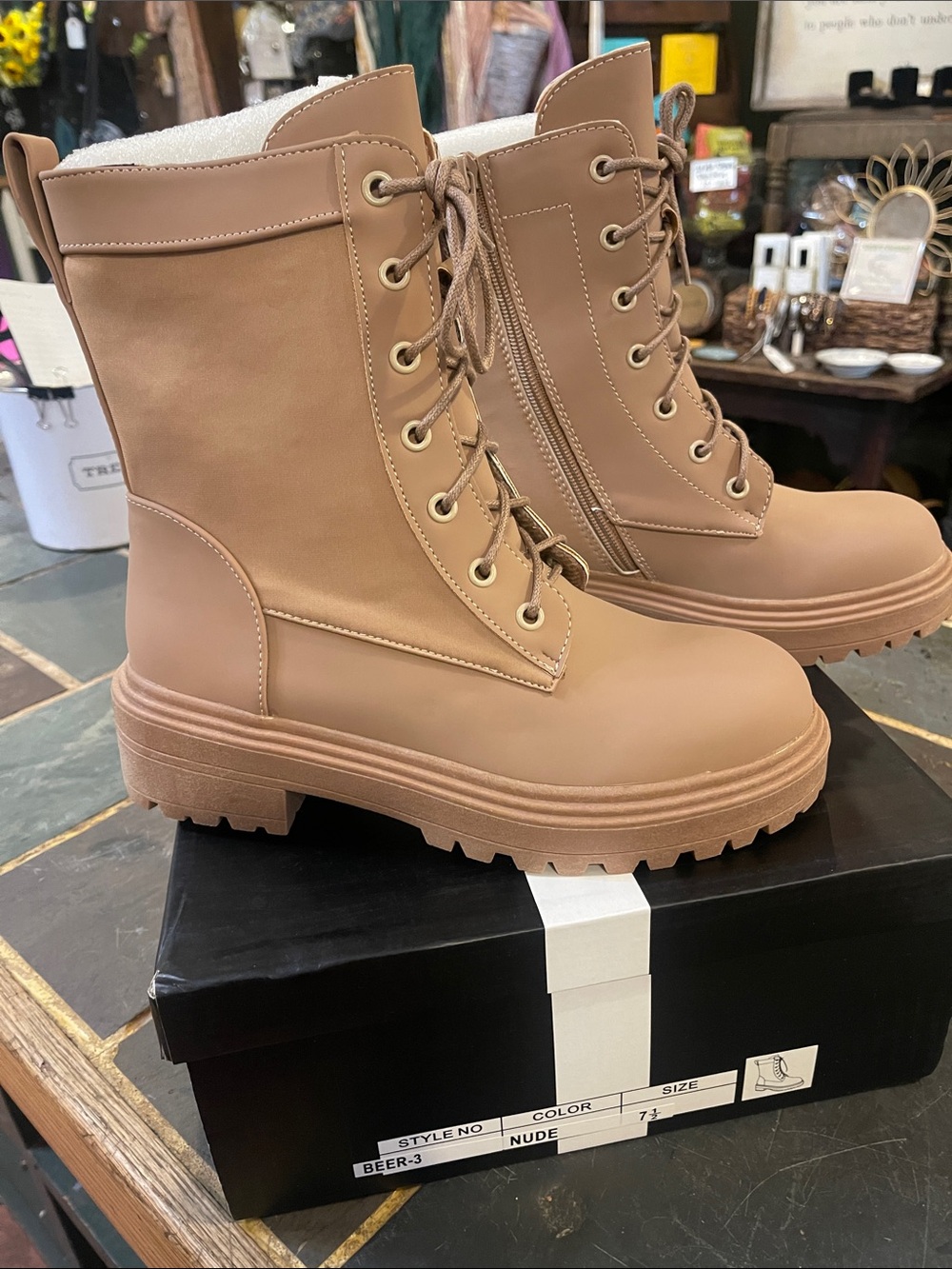 NIB tan combat boots with side zipper. Never worn size 7.5